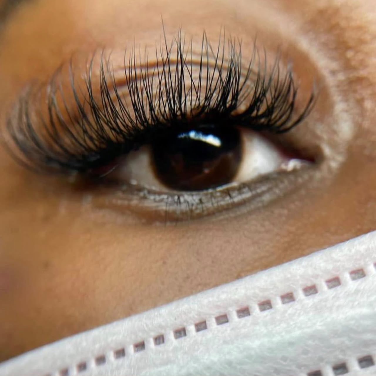Close up of elegant lash extensions applied at Wunmy Nails in Egbeda, Lagos